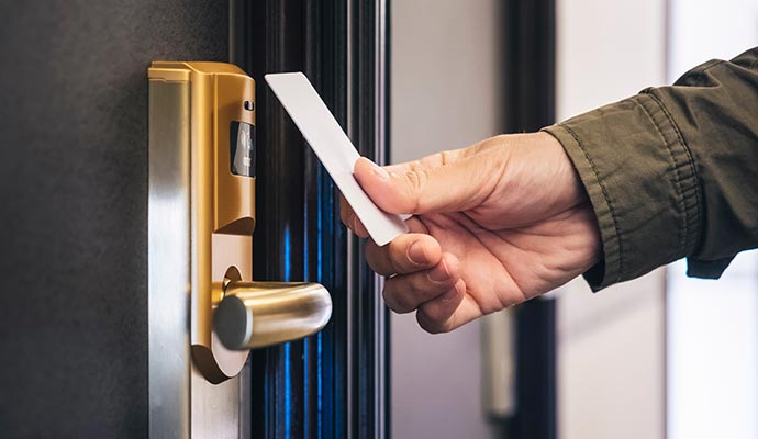 A person interacting with an installed touchless door system