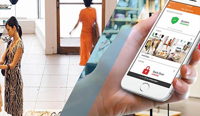 Person checking security system notification in smartphone.