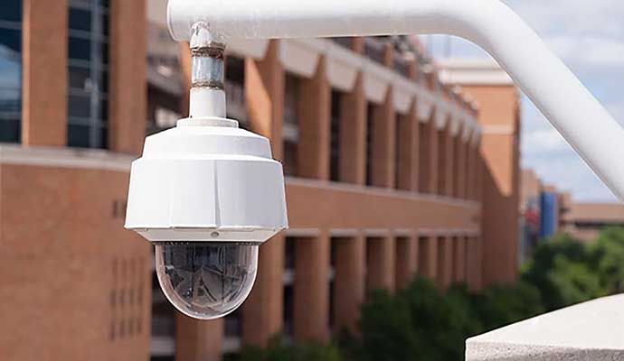 Outdoor security camera mounted on a post